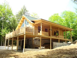 resilient Katahdin Cedar Log Home package under construction