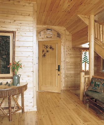 Entrance to master bedroom with decorative wooden door