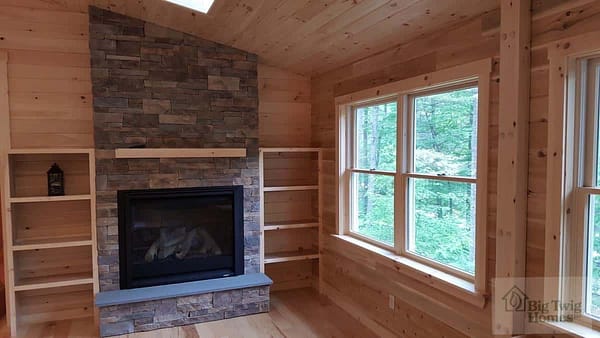 A custom fireplace in a log home.