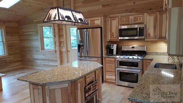 A beautiful custom kitchen in a log home built by Big Twig Homes.
