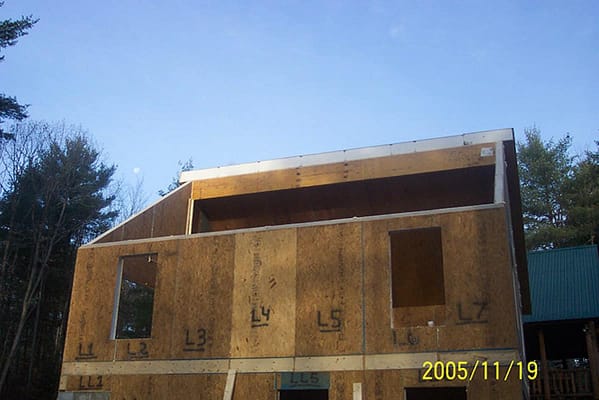 The walls and roof being constructed with structurally insulated panels.