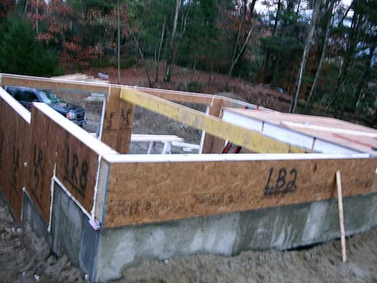 The backside of the garage foundation being constructed.