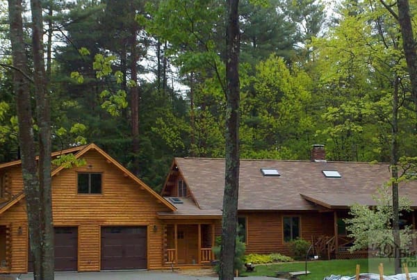A view of the garage on a log home.